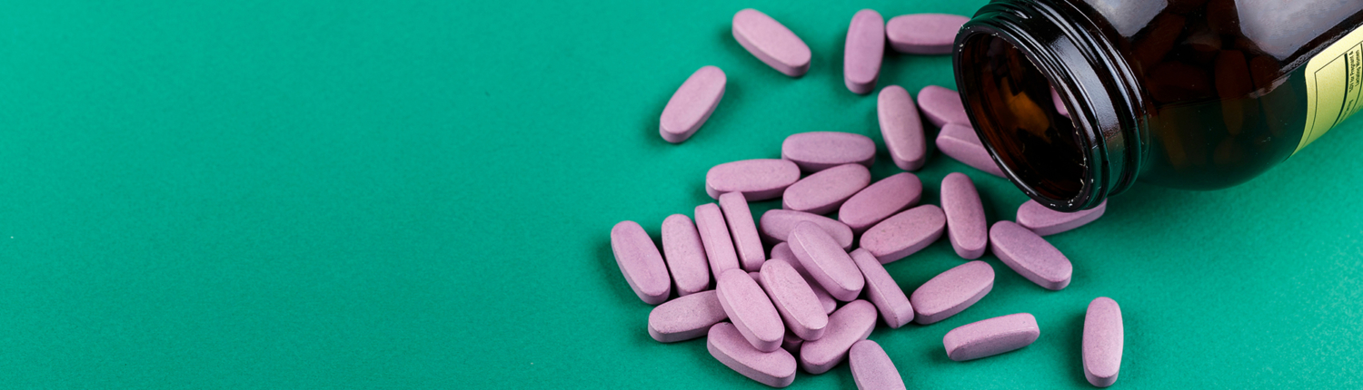 March Blog 2 Image View of coated tablets spilled out of a medicine bottle