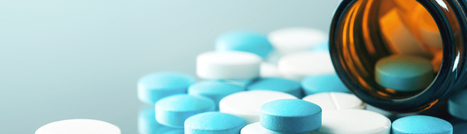 November Blog Image 1 View of uncoated tablets falling out of a medicine bottle